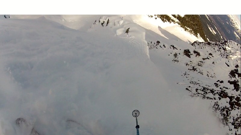 Surfing some turns out of the spine while my slough heads down to make a waterfall over the exposure
