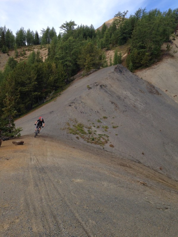 The trail follows a ridgeline made of hard packed scree.