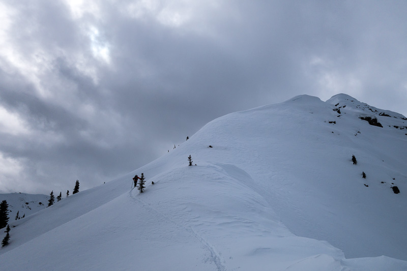 Ryan breaks trail up the summit ridge.
